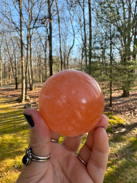 Orange selenite sphere