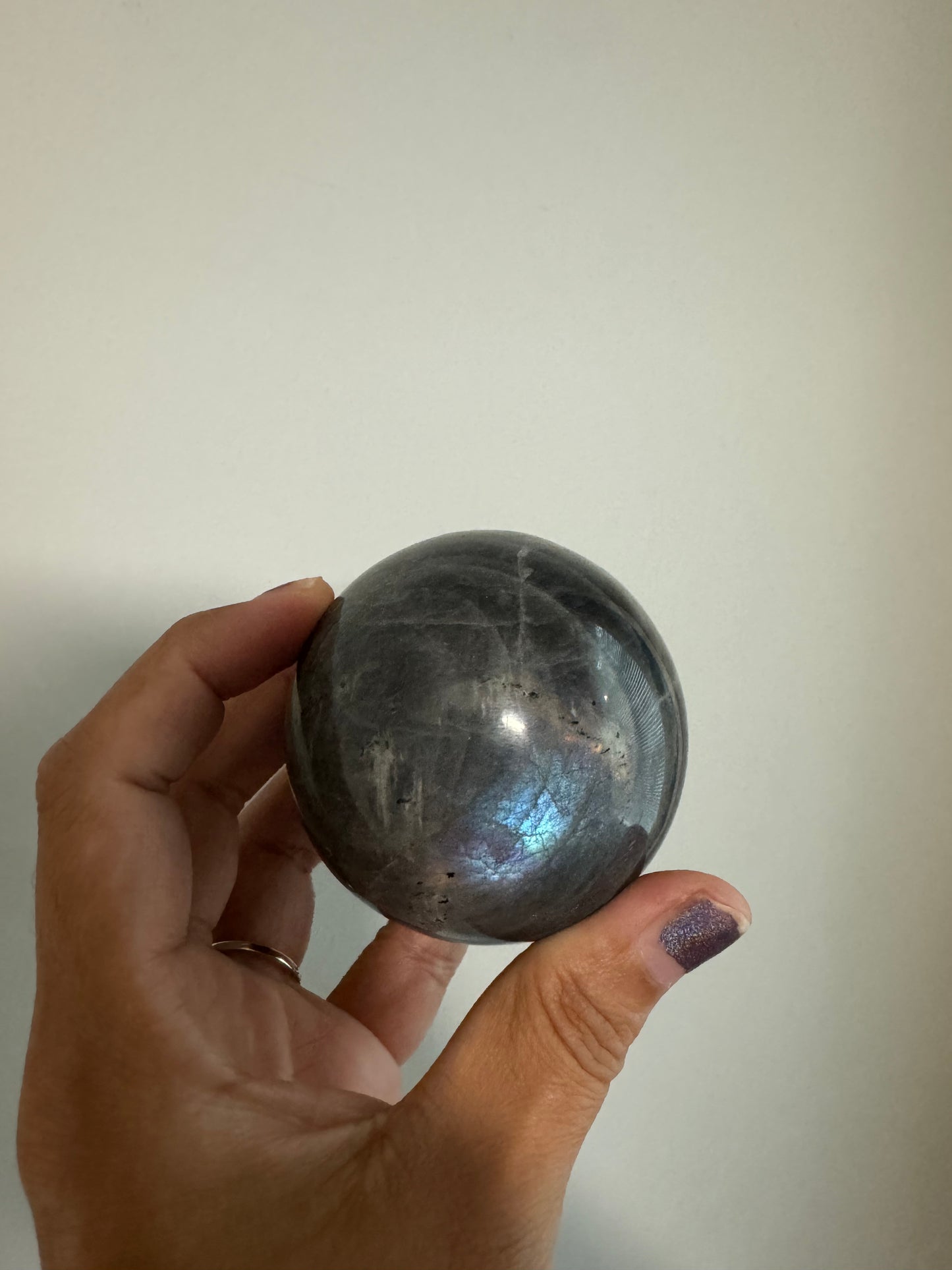 Purple and blue labradorite sphere